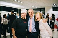 Skilled private chef with happy guests at a Melbourne event, personalised catering by Your Private Chef AU.