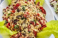 Delicious rice salad with fresh vegetables and herbs, perfect for private chef catering in Australia.