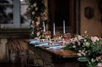 Elegant dinner table setup with floral arrangements and fine dining accessories in Sydney.