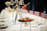 Elegant catered dining setup with gourmet dishes for private events in Australia.