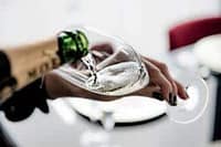 Elegant glass of champagne being poured at a private dining event in Australia.