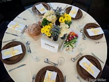 Elegant dinner table setup with floral centerpiece and fine dinnerware in Sydney.