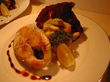 Delicious gourmet seafood dish with lobster, vegetables, and sauce for private chef dining experience.