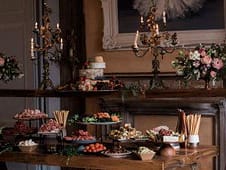 Elegant dessert table setup with cakes, sweets, and floral decor for private chef events in Australia.