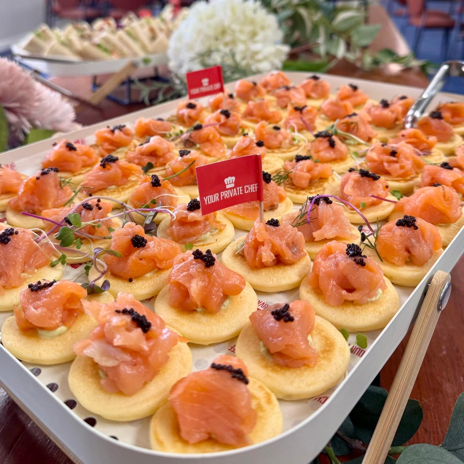 Blinis with smoked salmon, dill caper cream cheese and micro herbs