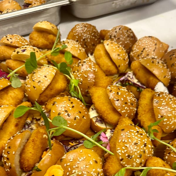 Brioche mini burger bun with crisp chicken and chipotle mayo slaw